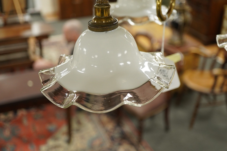 A late 19th century decorative brass, three branch hanging light, with fluted glass shades, 63cm high
